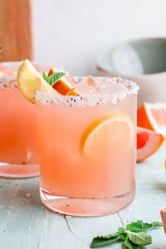 grapefruit paloma drink in short glass.