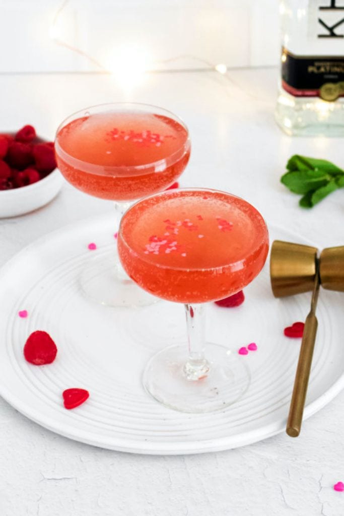 pink vodka spritzer cocktails with valentines sprinkles.