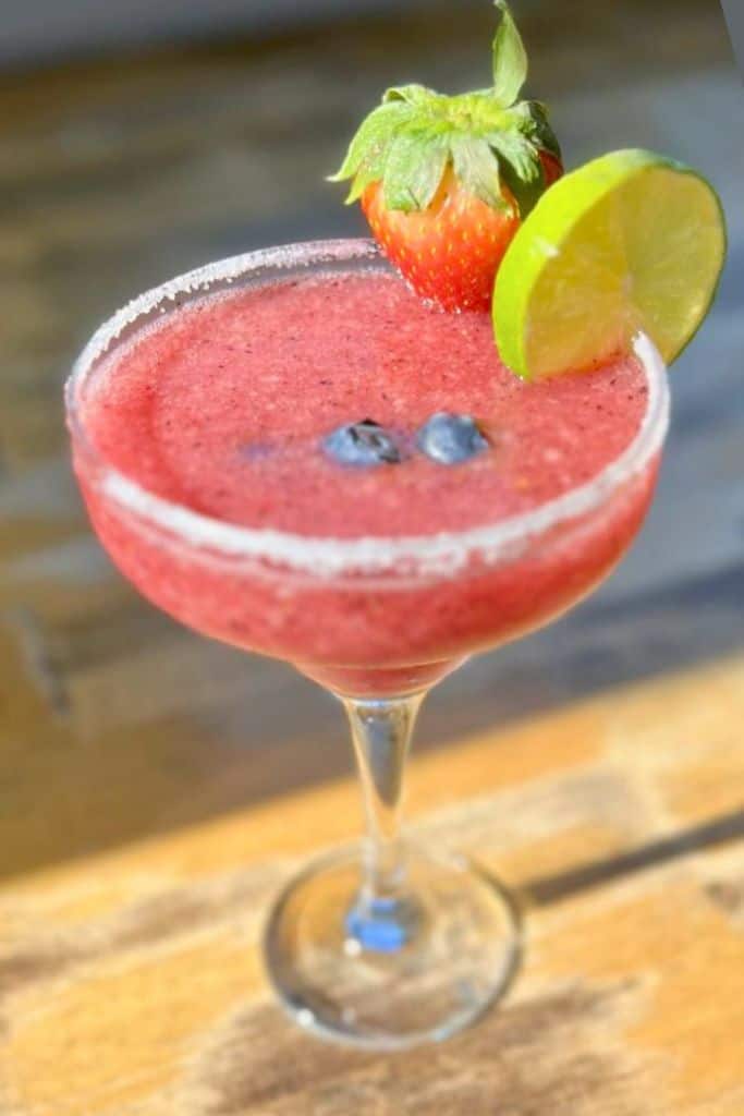 strawberry margarita with garnishes.