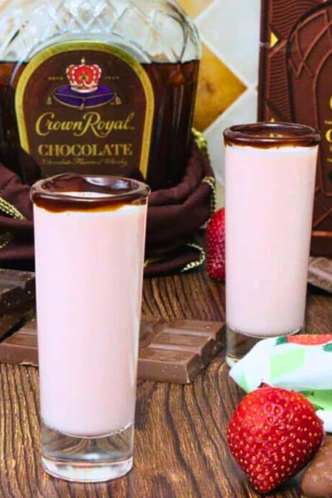 creamy strawberry shots in chocolate rimmed glass.