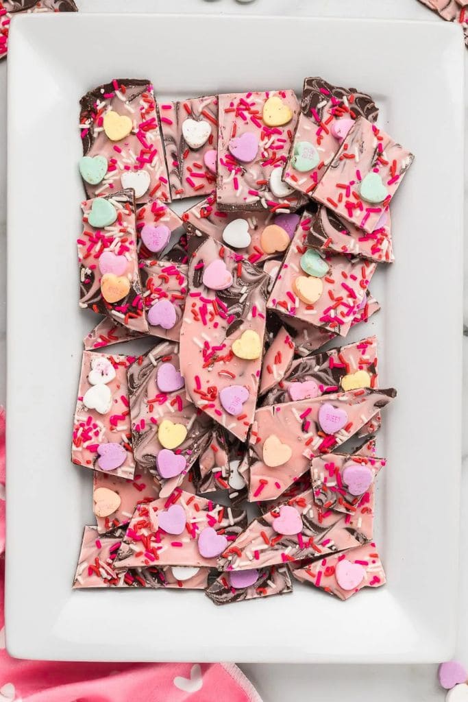 valentines day strawberry chocolate bark on a platter.