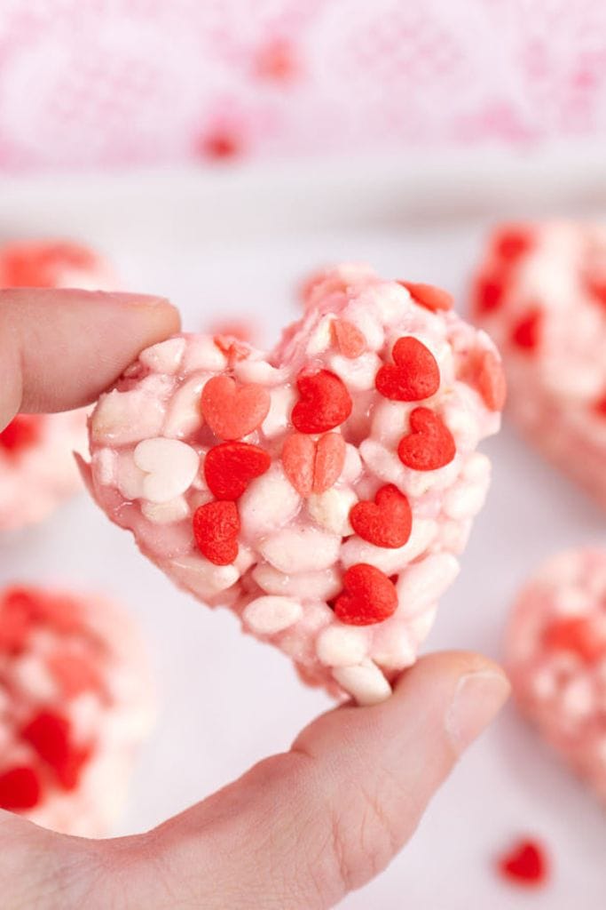 love heart shaped rice krispies with red candy hearts.