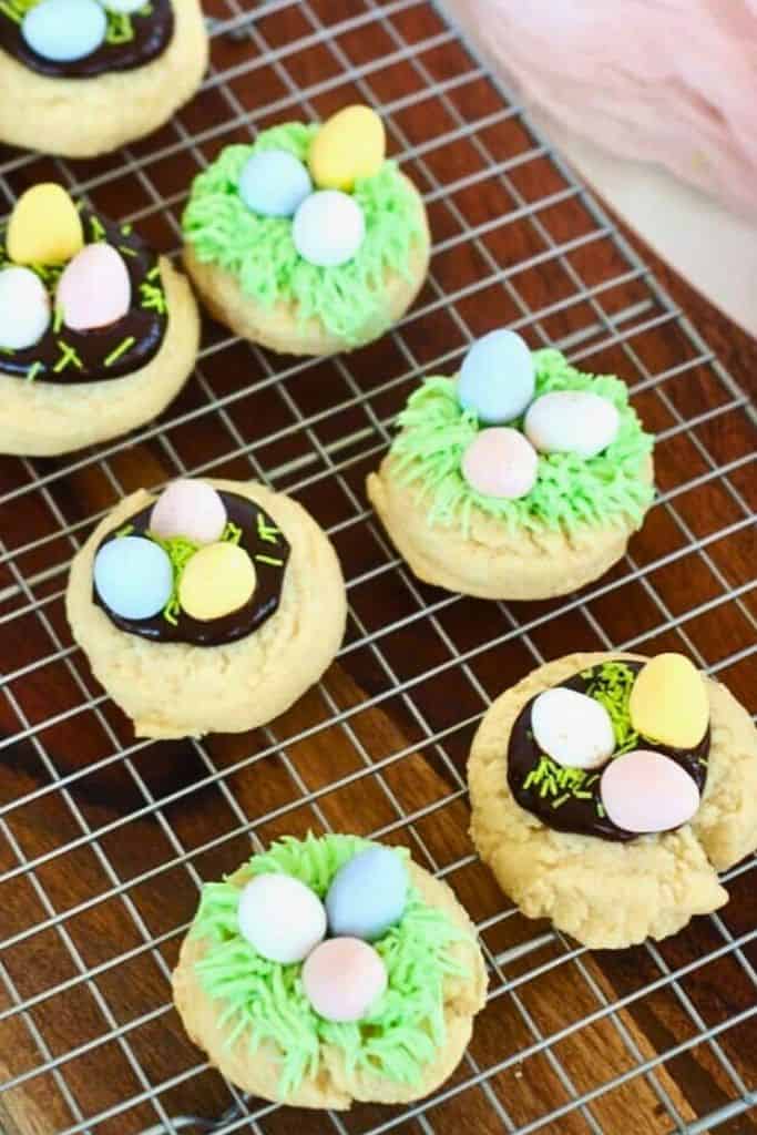birds nest cookies with easter decorations on wire rack.