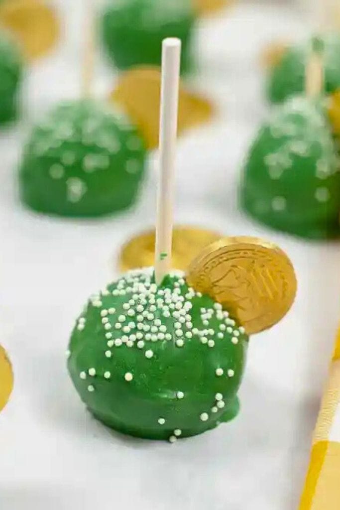 st patricks day green cake pops with gold chocolate coin.