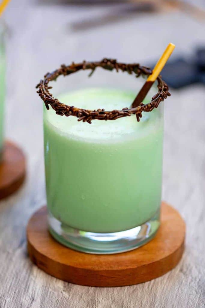 green frozen drink with chocolate sprinkles.