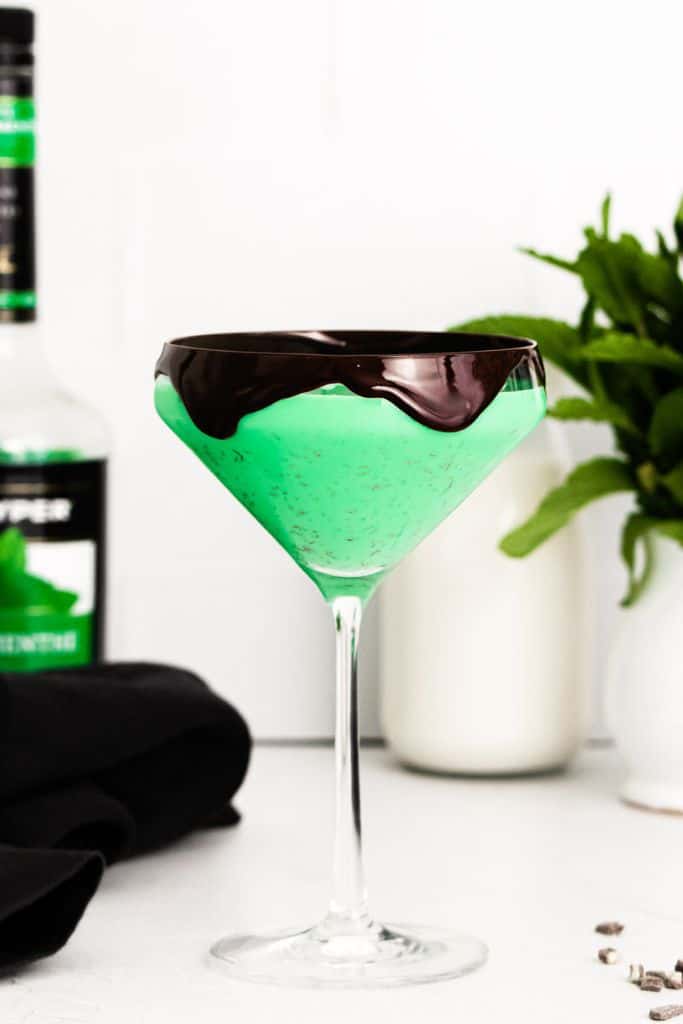 green grasshopper cocktail with melted chocolate rim.