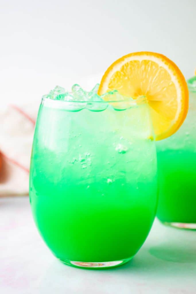 green screwdriver with slice of orange.