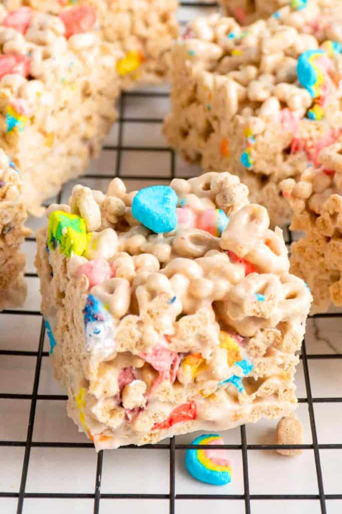 lucky charms rice krispie treats on wire rack.