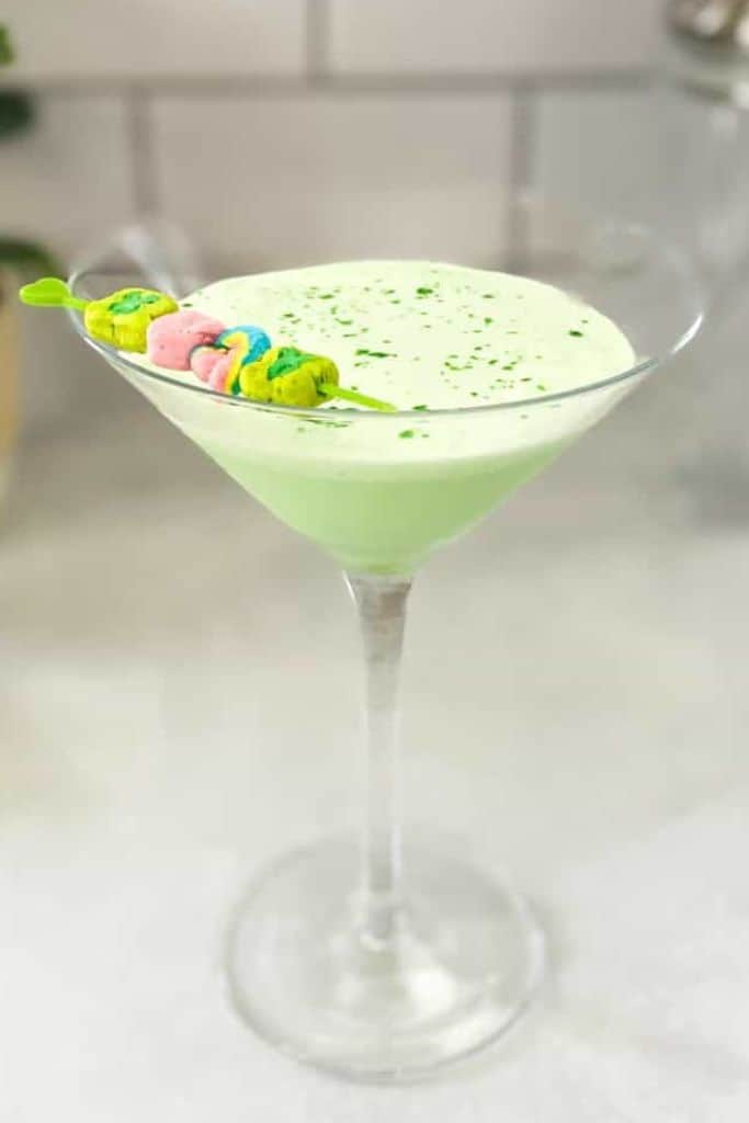 green martini with lucky charms marshmallows.