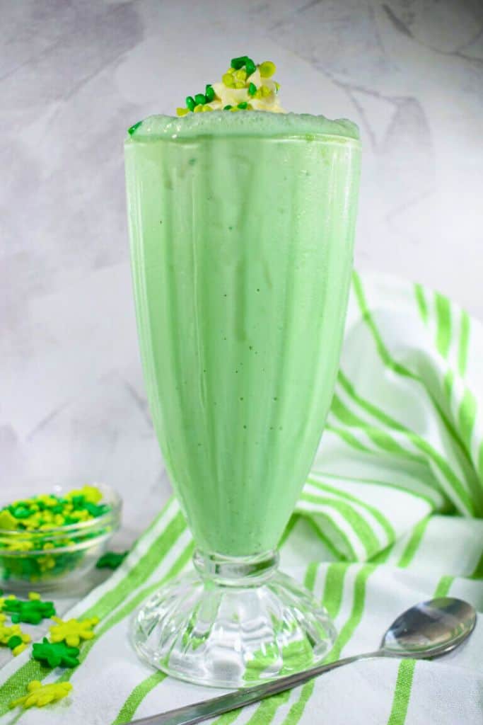 mint green milkshake in tall glass.