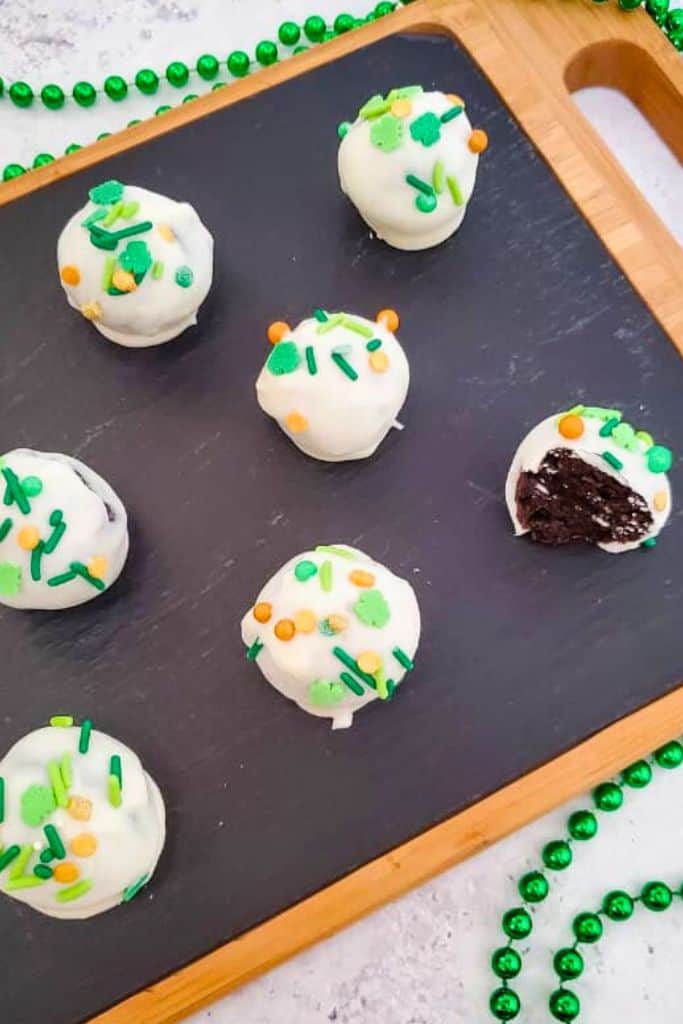 st patricks themed oreo truffles on platter.