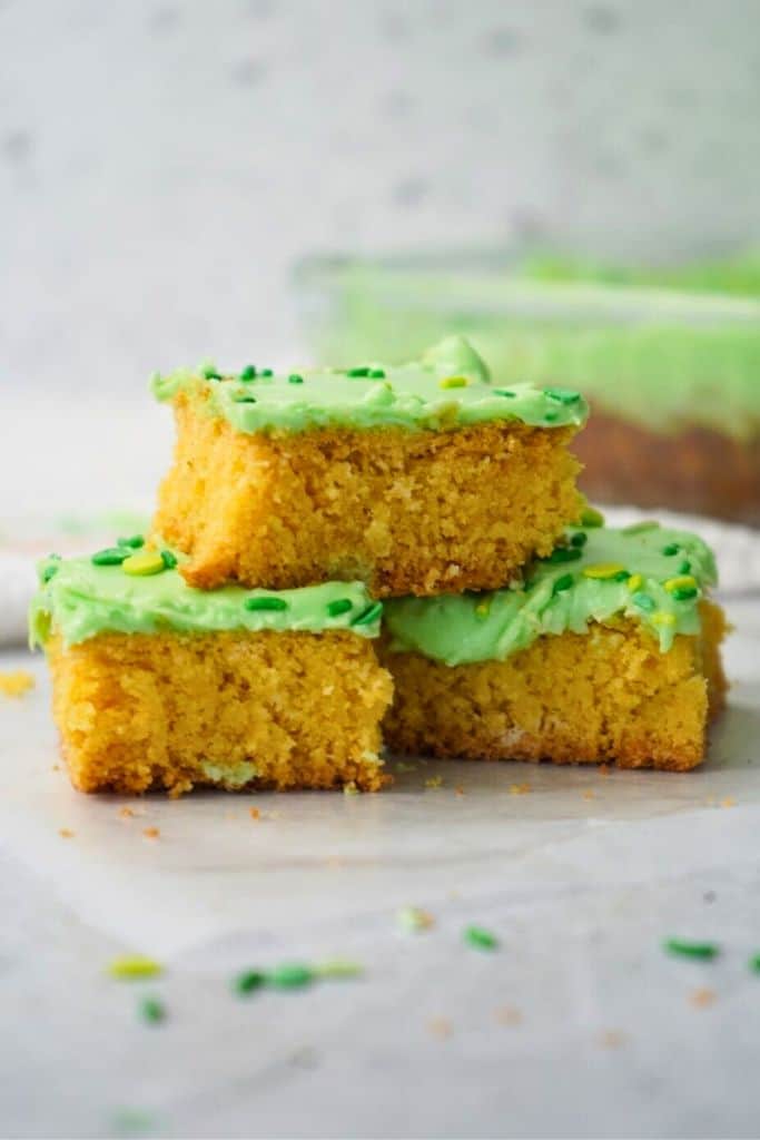 stack of green frosted sugar cookie bars.
