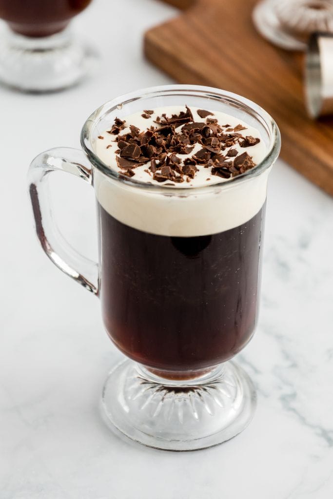 classic irish coffee drink with shaved chocolate.