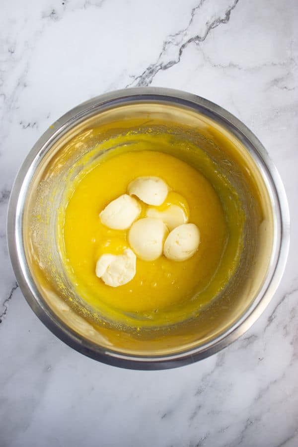 adding butter to lemon curd.