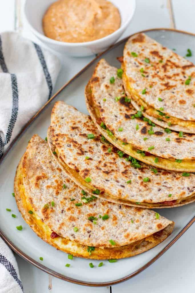 smashed egg breakfast tacos on platter.