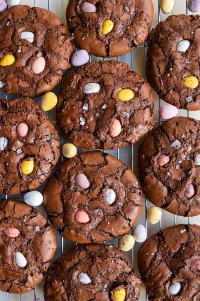 cadbury egg chocolate flourless cookies on rack.