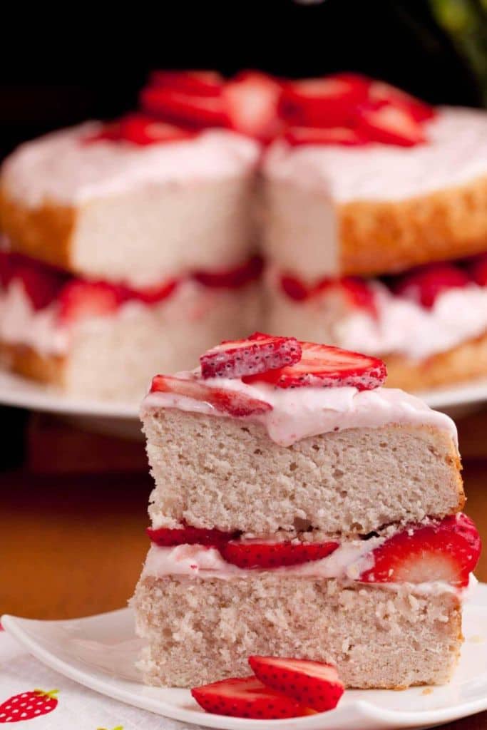 slice of strawberry layered cake on plate.