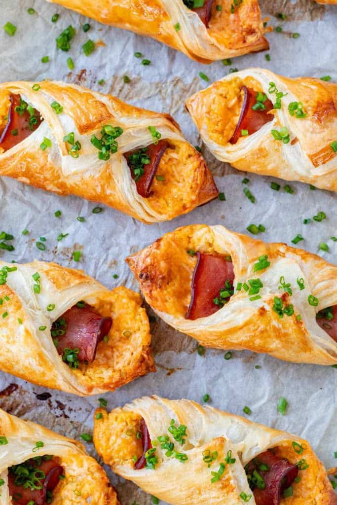 mini baked croissants with ham and cheese.