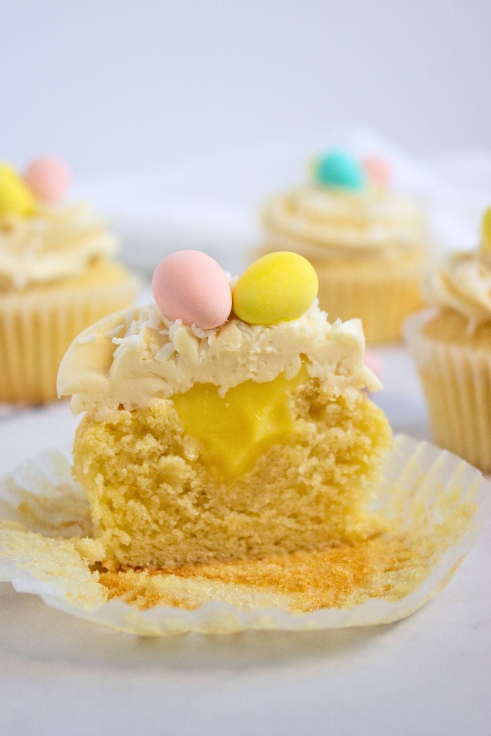 lemon curd filled cupcake cut in half.