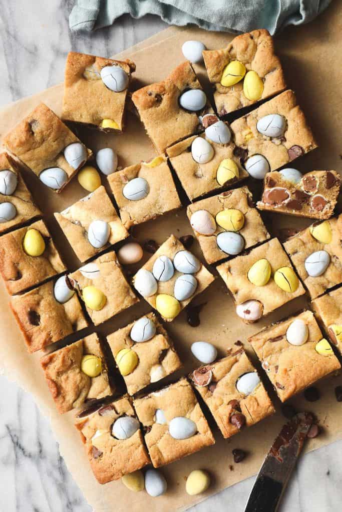cadbury egg cookie bars on board.