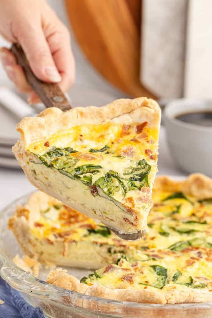 slice of spinach and bacon quiche.