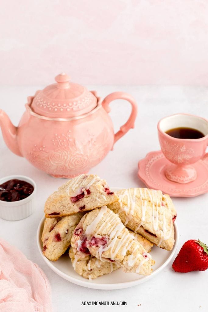 strawberry scones with tea pot and cup.