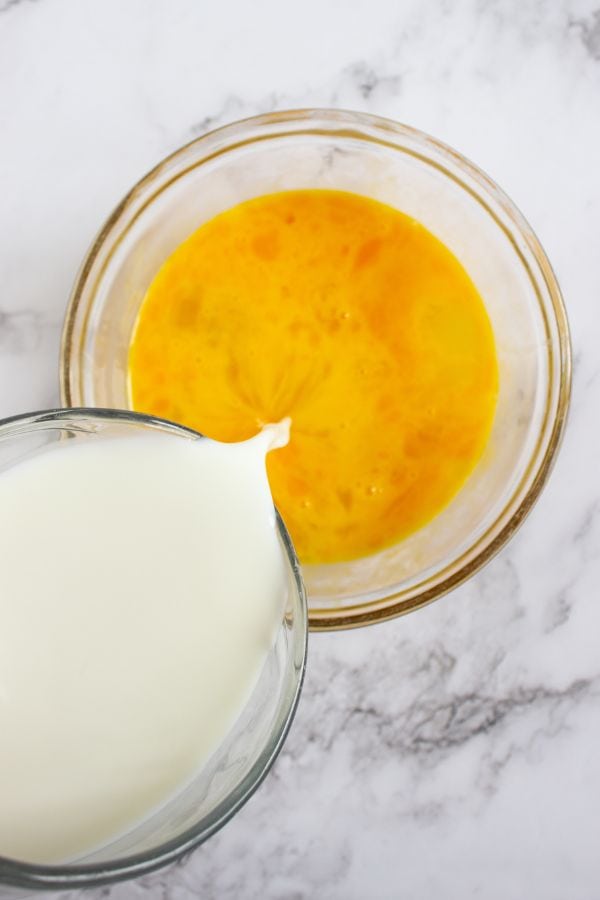 eggs and milk in bowl.
