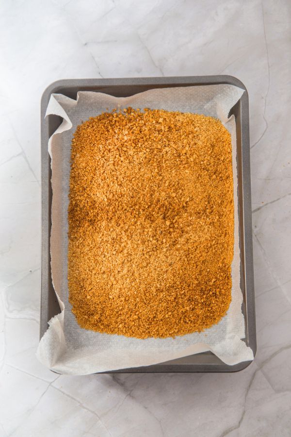 baked graham cracker base on tray.