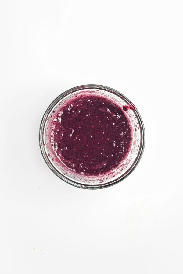 blended blackberries for popsicles in bowl.
