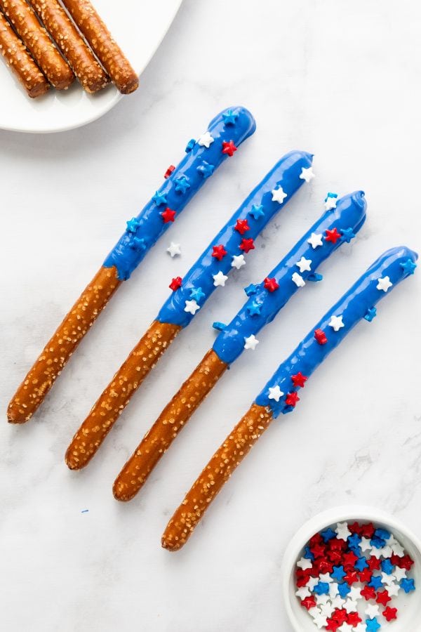 blue chocolate covered pretzel rods decorated.