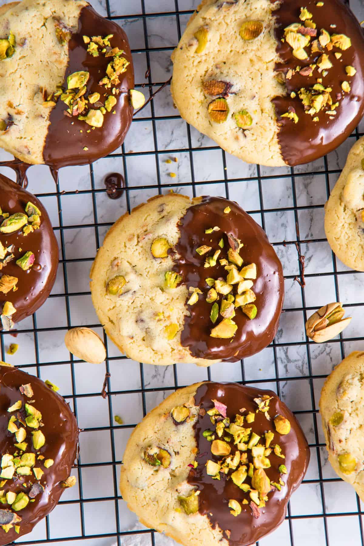 chocolate pistachio cookies on wire rack.