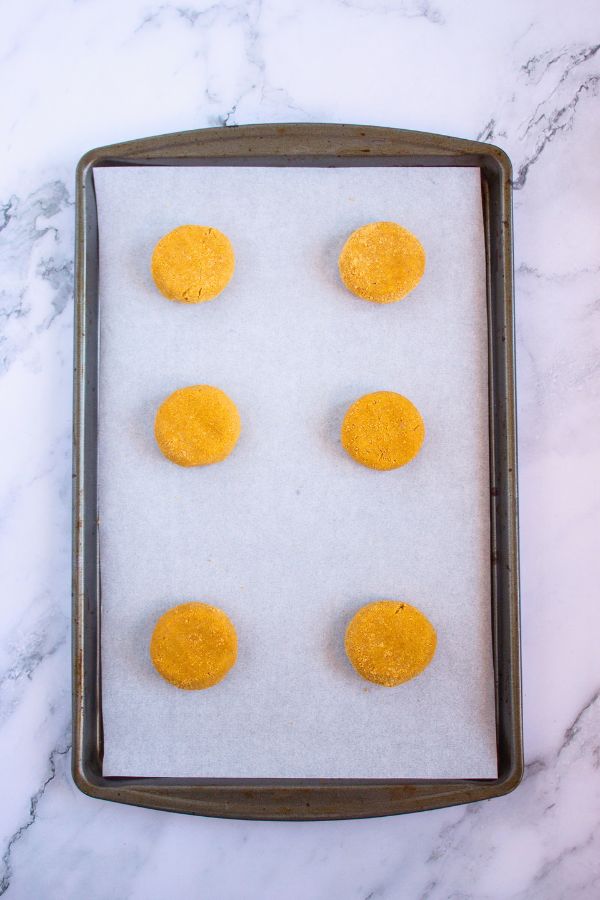 unbaked graham cracker cookies on baking tray.