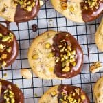 dark chocolate pistachio cookies on wire rack.