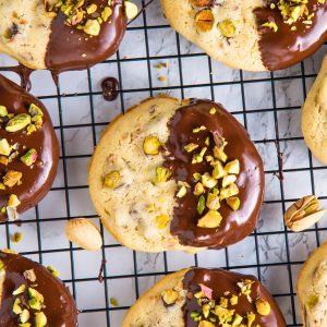 dark chocolate pistachio cookies on wire rack.