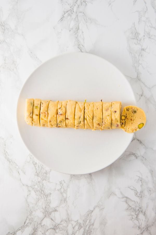 frozen cookie dough sliced into rounds.
