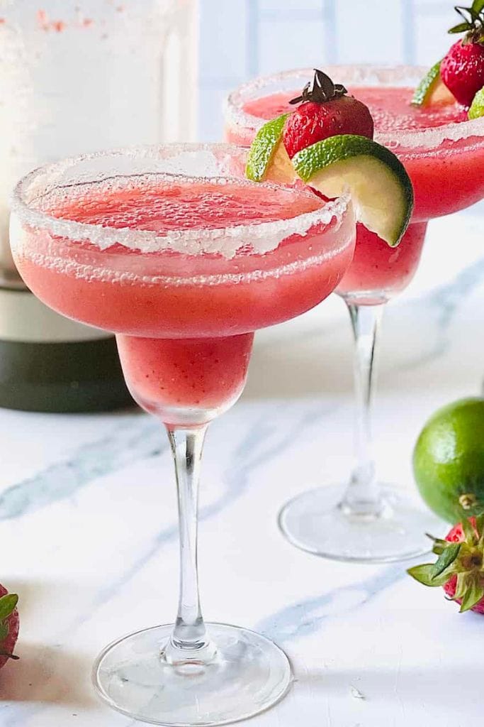 red frozen margarita in tall glass.