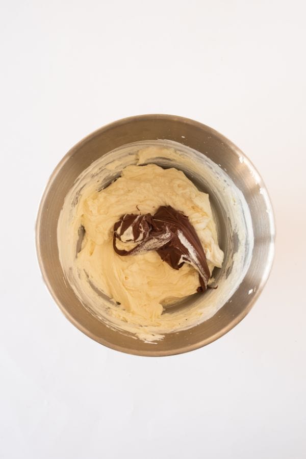 mixing lotus biscoff spread into cream.