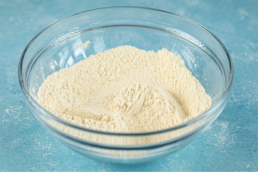 peach crumble bar base mixture in bowl.