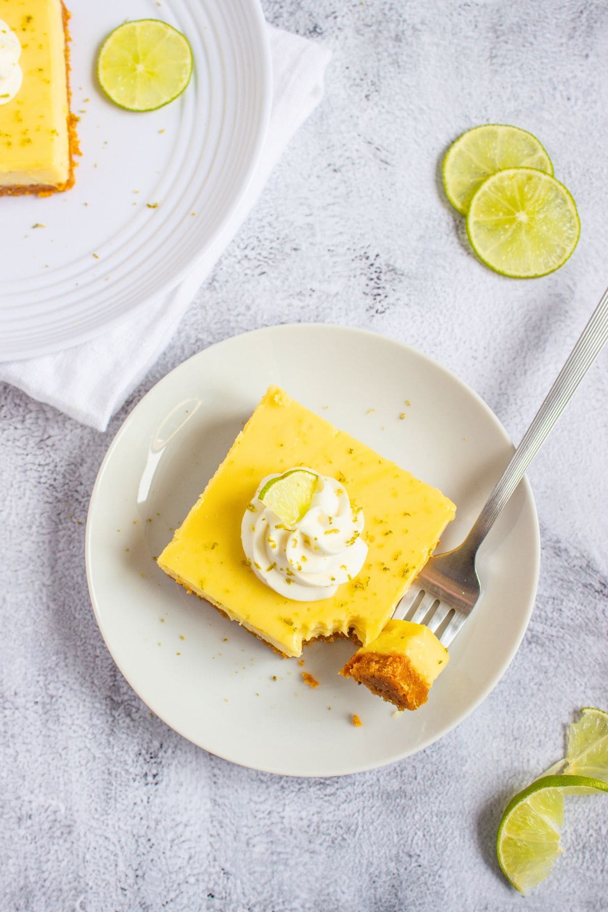 key lime dessert bar on plate with fork top view.