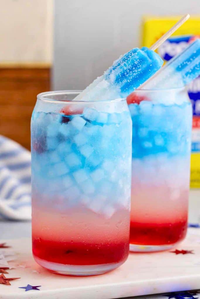 red white and blue cocktail with ice pop.