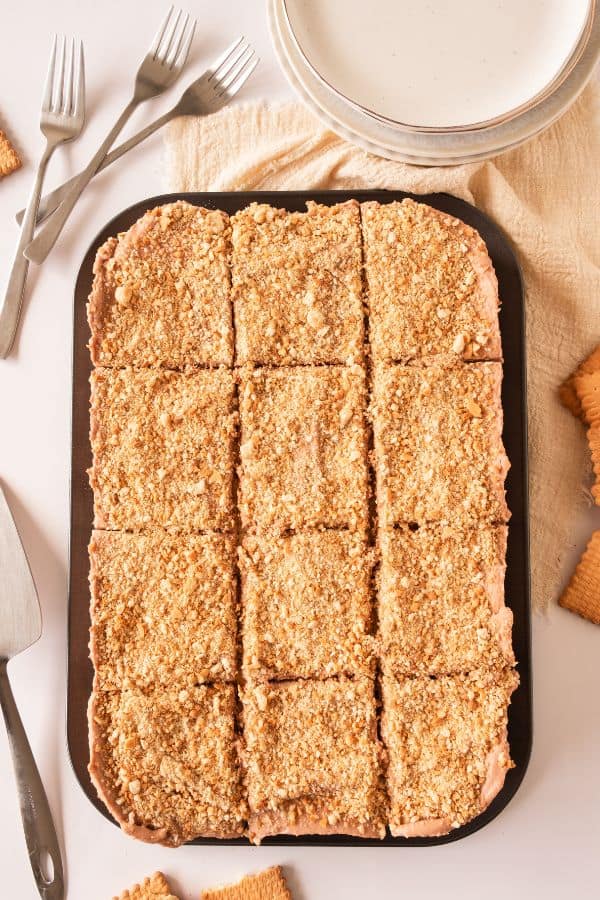 no bake cake sliced into pieces in tray.