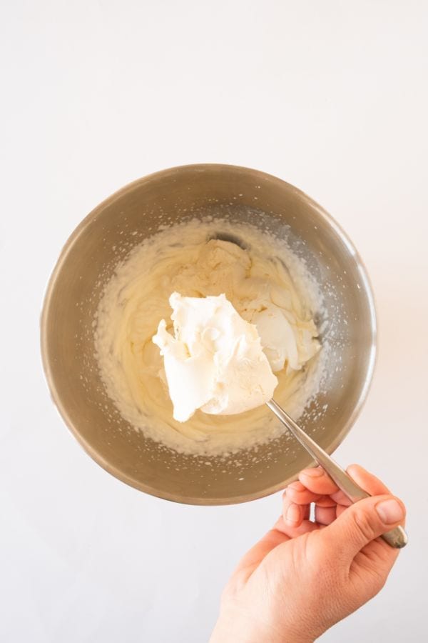 adding mascarpone cream to whipping cream.