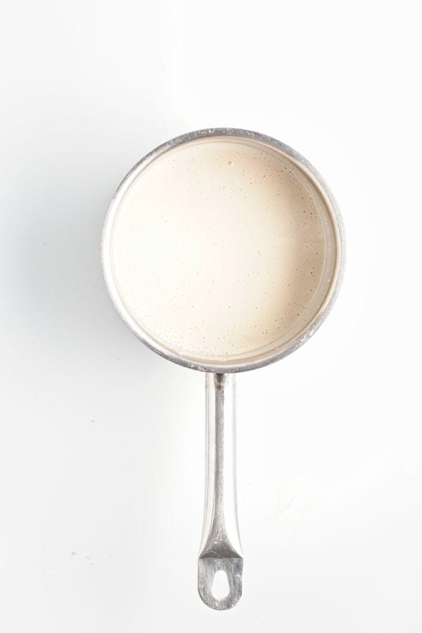 making coconut milk ice pops mixture in saucepan.