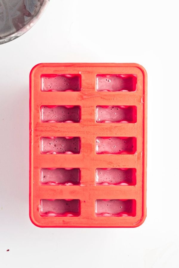 fruit popsicle mixture in popsicle mold.