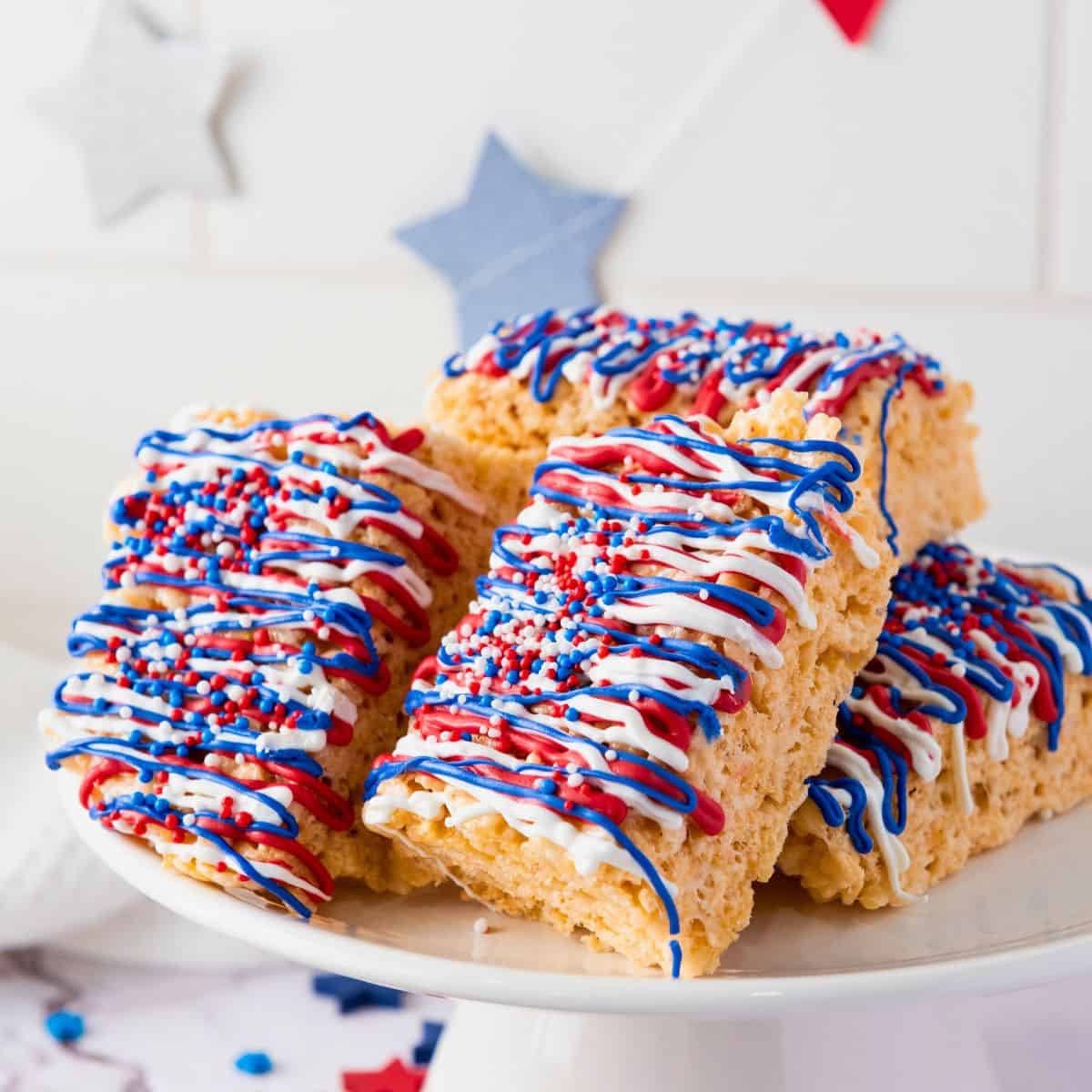 red white and blue rice krispie treats on platter.