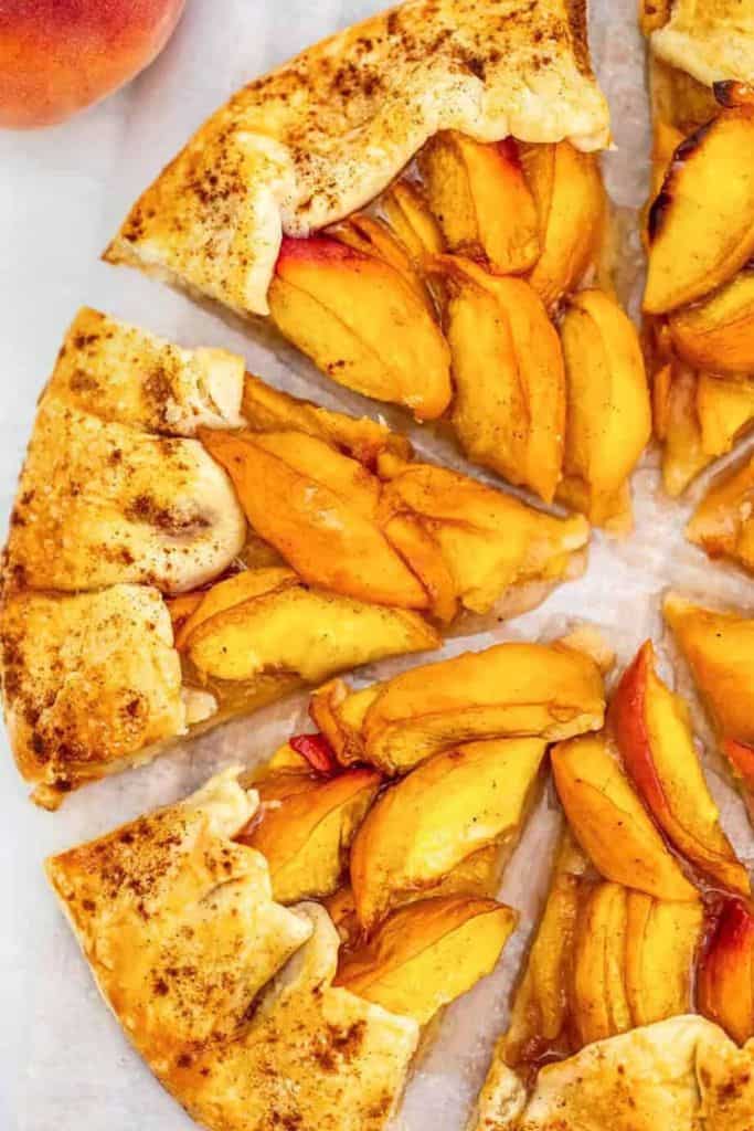fresh peach galette sliced.