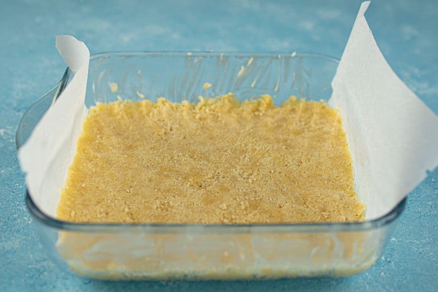 peach pie bars base pressed into lined pan.