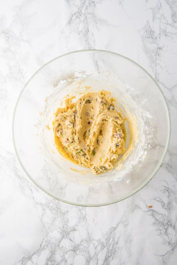 pistachio cookie dough mixture in bowl.