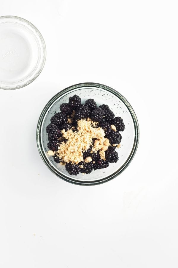 preparing blackberries and brown sugar in bowl.