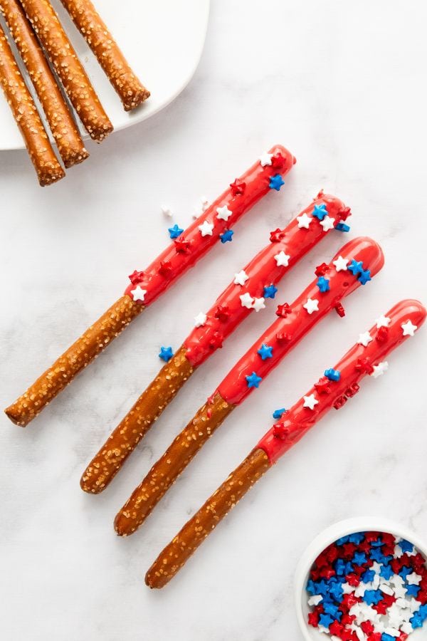 red chocolate pretzel sticks with patriotic sprinkles.